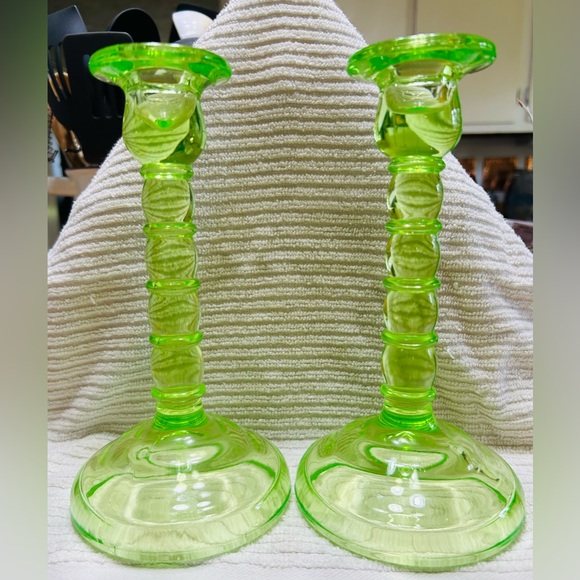 Vasoline glass Other - Antique vasoline glass candle stick holders, 8” tall by 4.25” wide at base.
